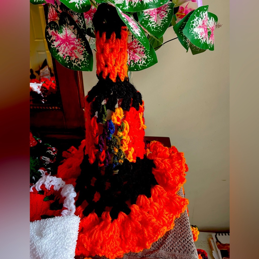 Festive hand-crocheted wine/bottle covers